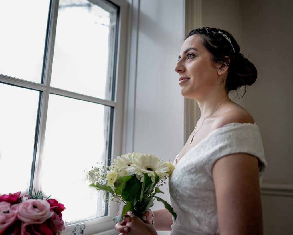 Bride solo shot looking out of window