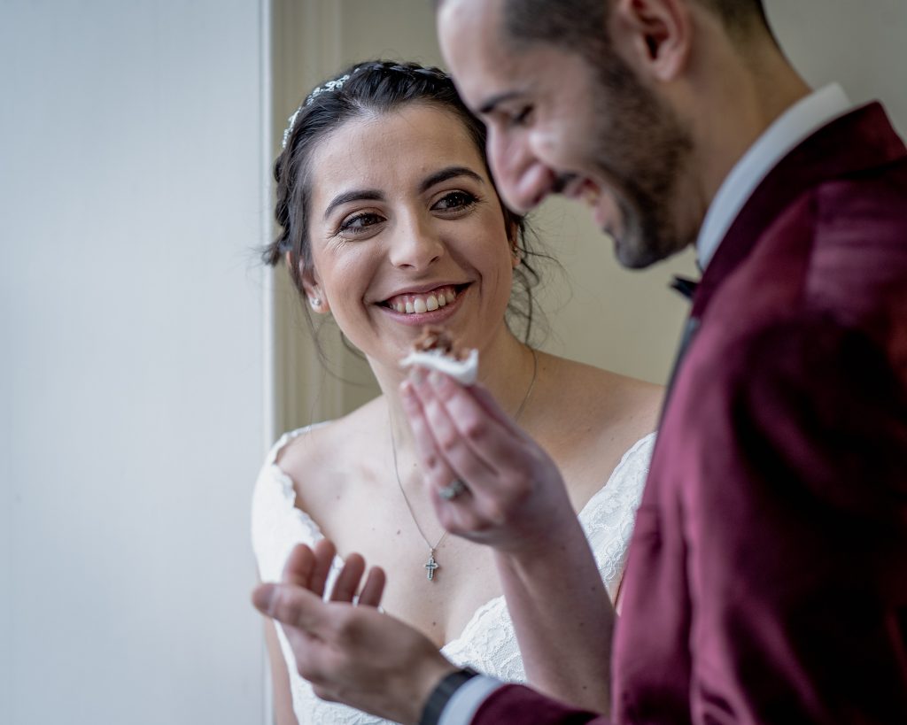 Sharing cake after wedding ceremony