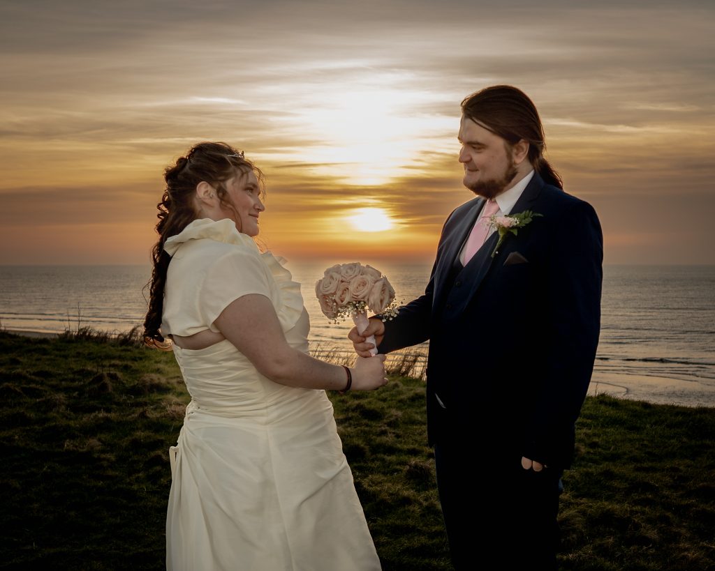 Bride and Groom watching the sunset