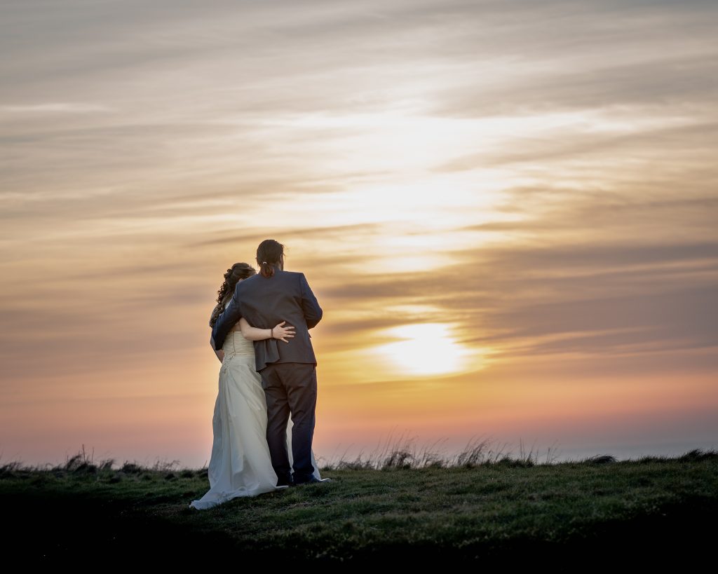 Bride and Groom watching the sunset