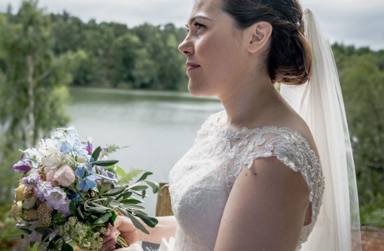 Bride portrait next to the lake at Nunsmere hall