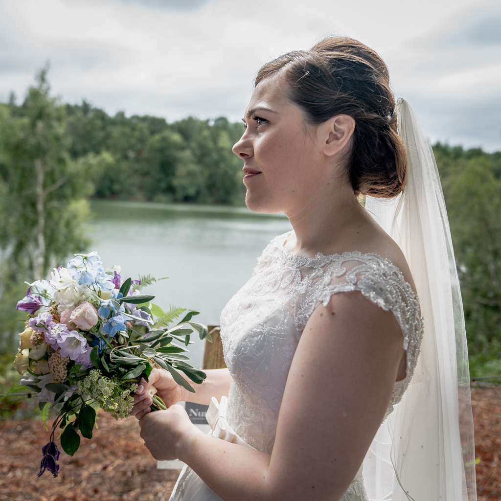 Bride portrait next to the lake at Nunsmere hall