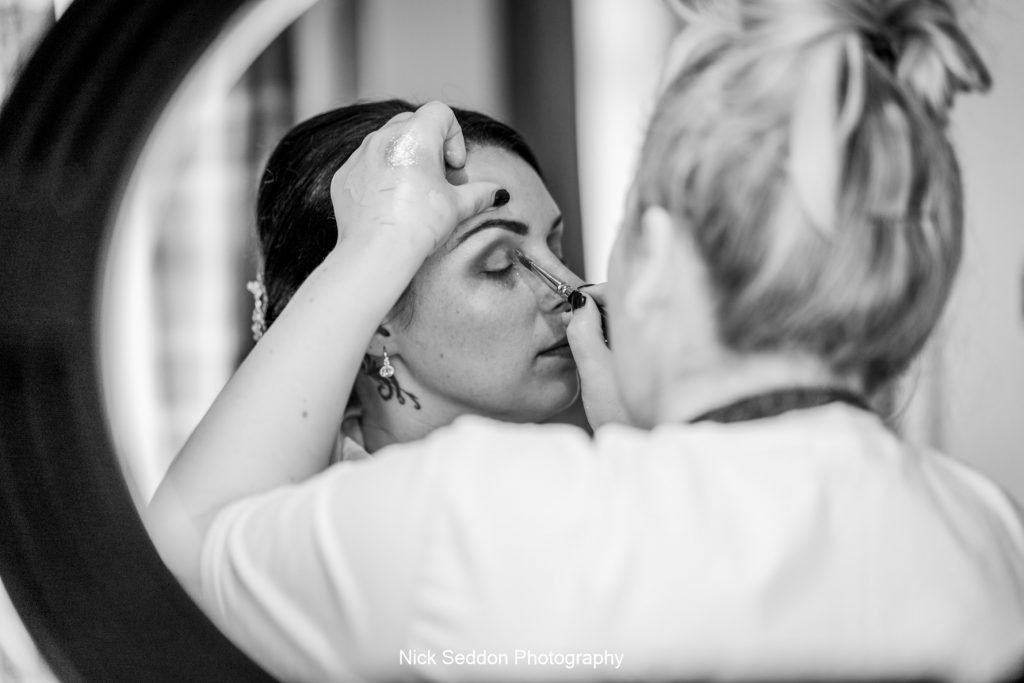 Bride preparations through ring light