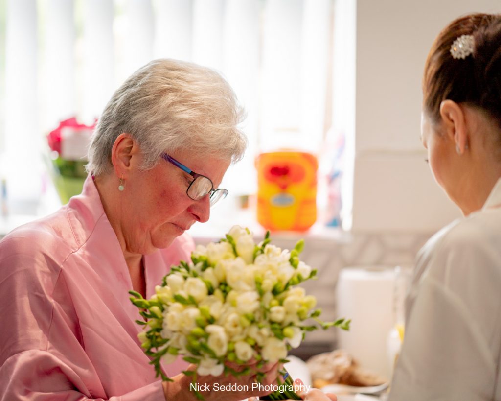 Brides mum checking the bouquet