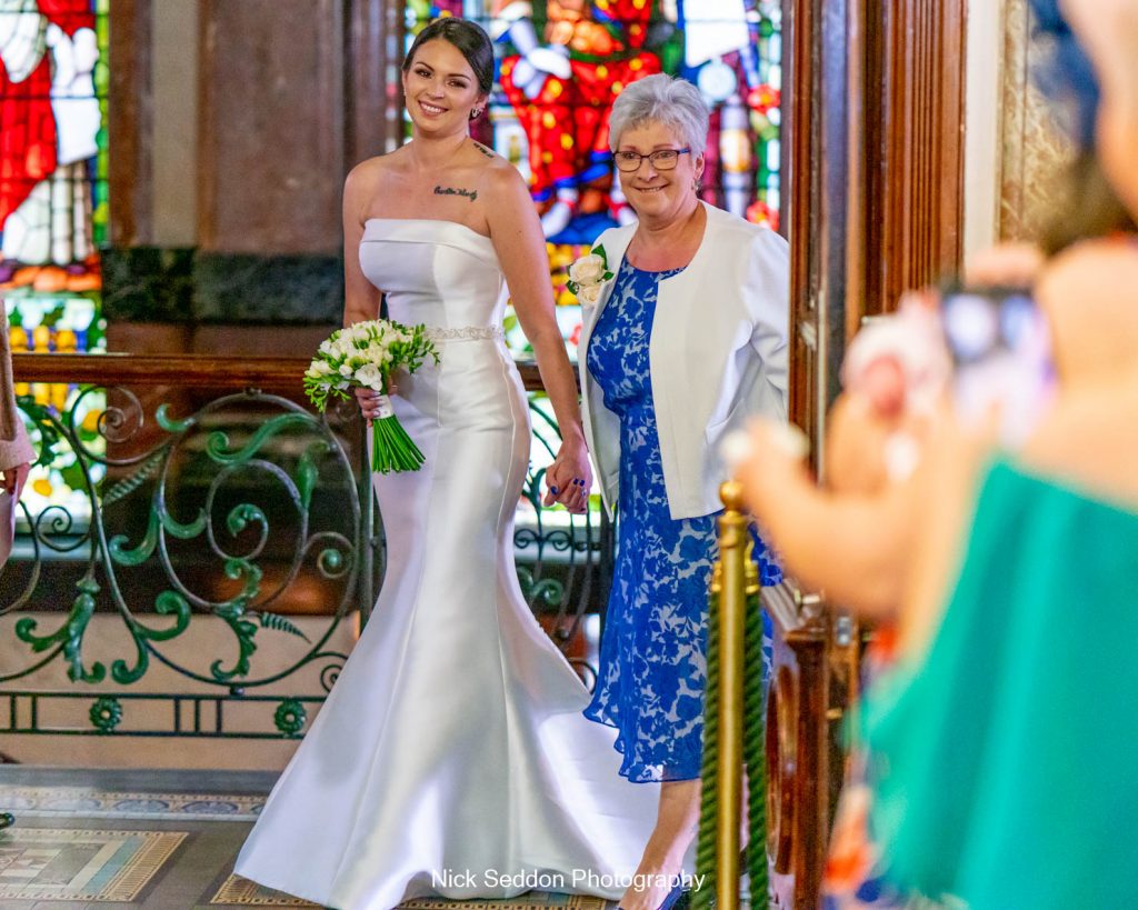 Bride and Mother walking down the isle